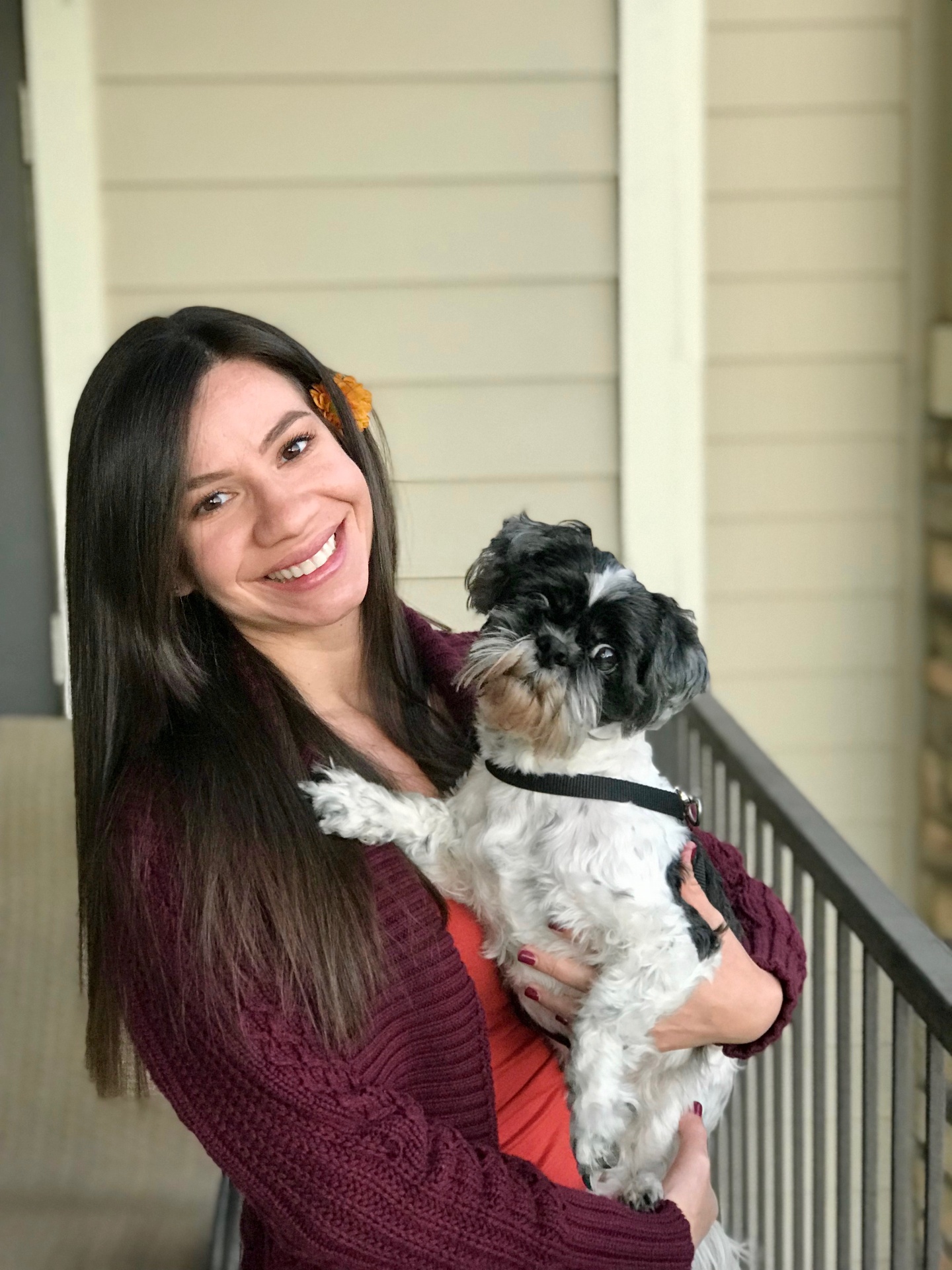 Lilly Lima, founder of Honeybear B&B, with a Doberman puppy